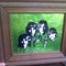 Framed Beatles print on green foil background