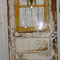 Partially restored stained glass door